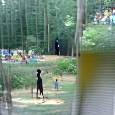 Eerie Figure Watching Children in Woods