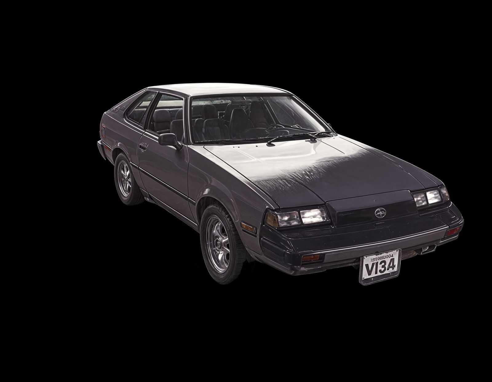 Retro-Futuristic Toyota Celica Cruises Under Sunset Palm Tre...