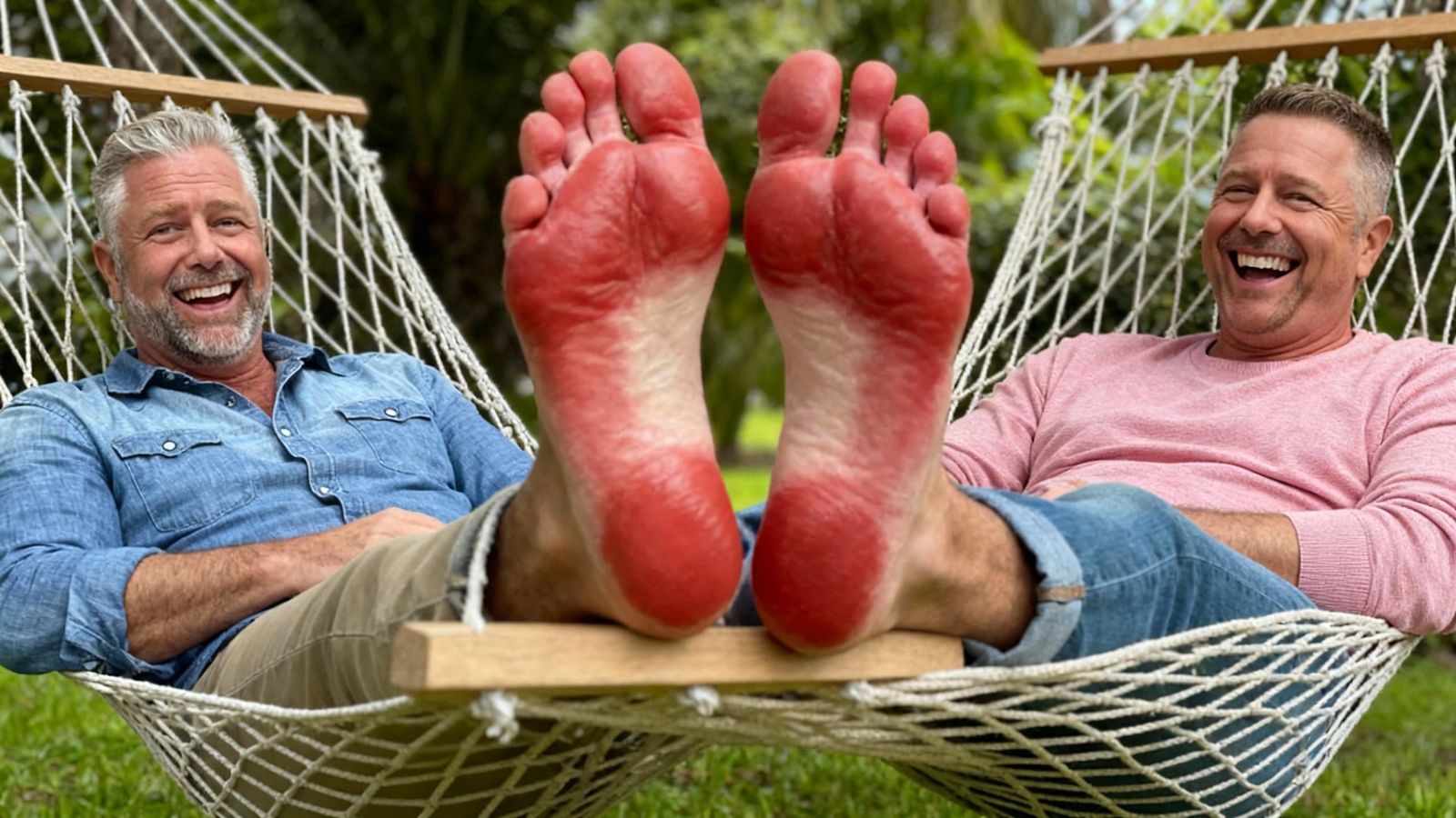 Two Smiling Men Relax on Hammocks Showing Bare Feet