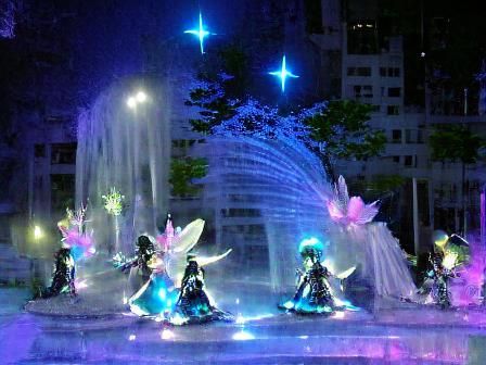 Enchanted Night Fairies Dance Near a Sparkling Fountain