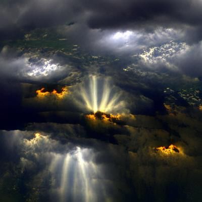 Sun Rays Through Dark Clouds