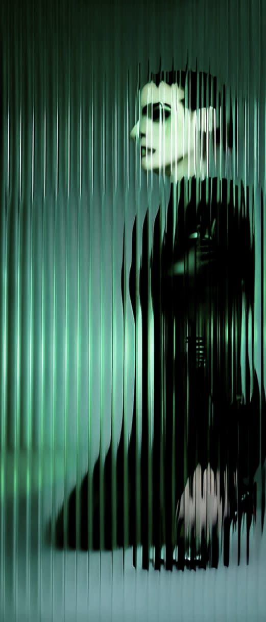 Model in Glossy Black Outfit in Dark Studio