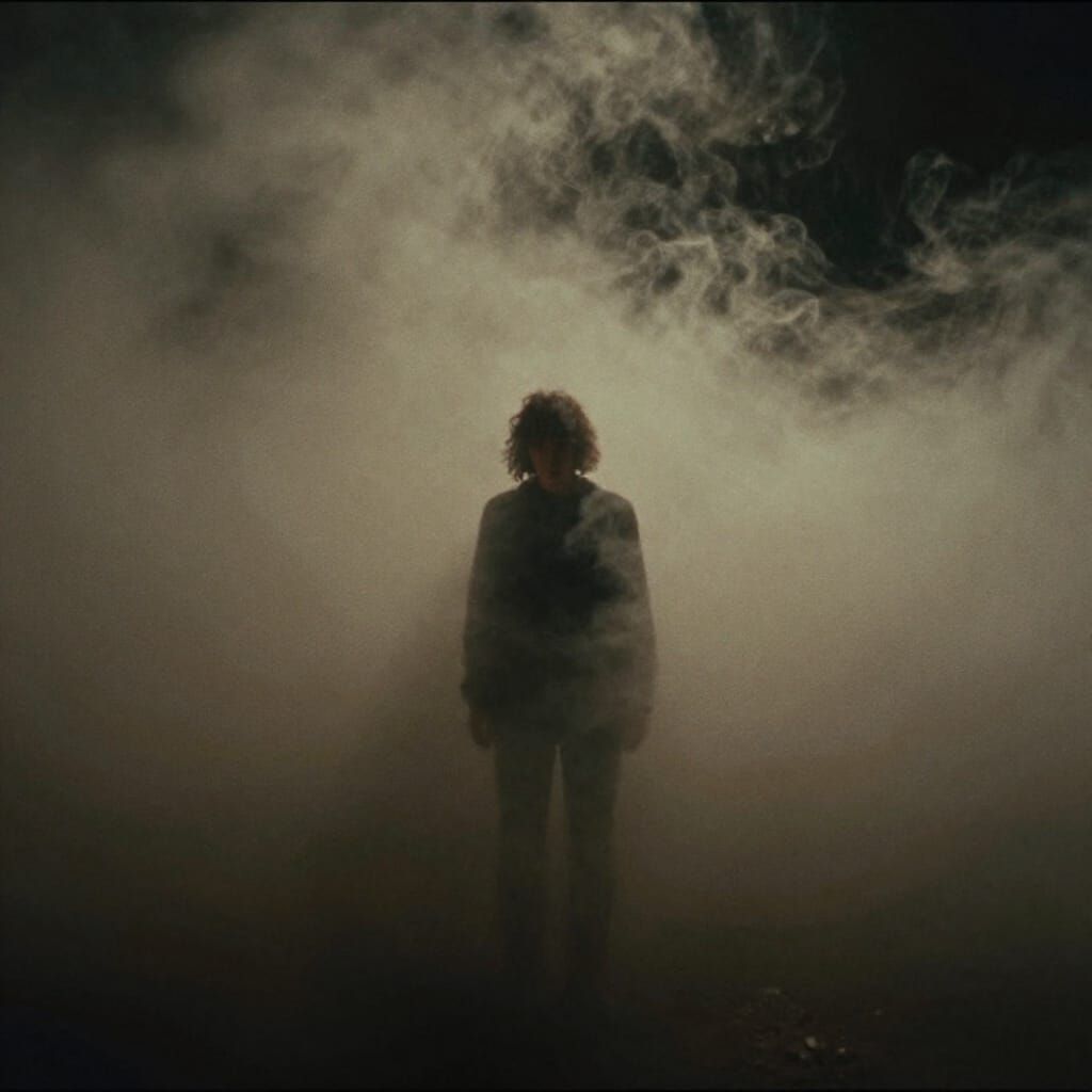 Solitary Figure Emerges From Mysterious Ethereal Mist