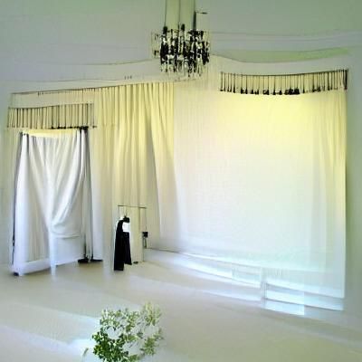 Minimalist White Room with Black Curtains