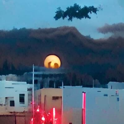 Bad Moon Rising Over Dark Landscape