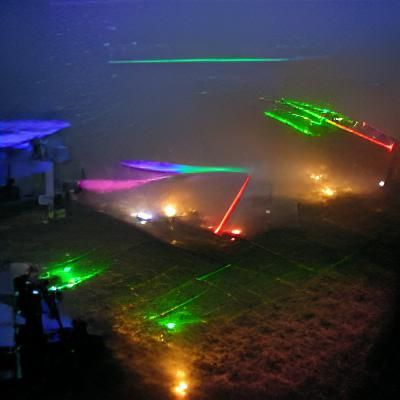 Vibrant Laser Beams Pierce Through Thick Fog