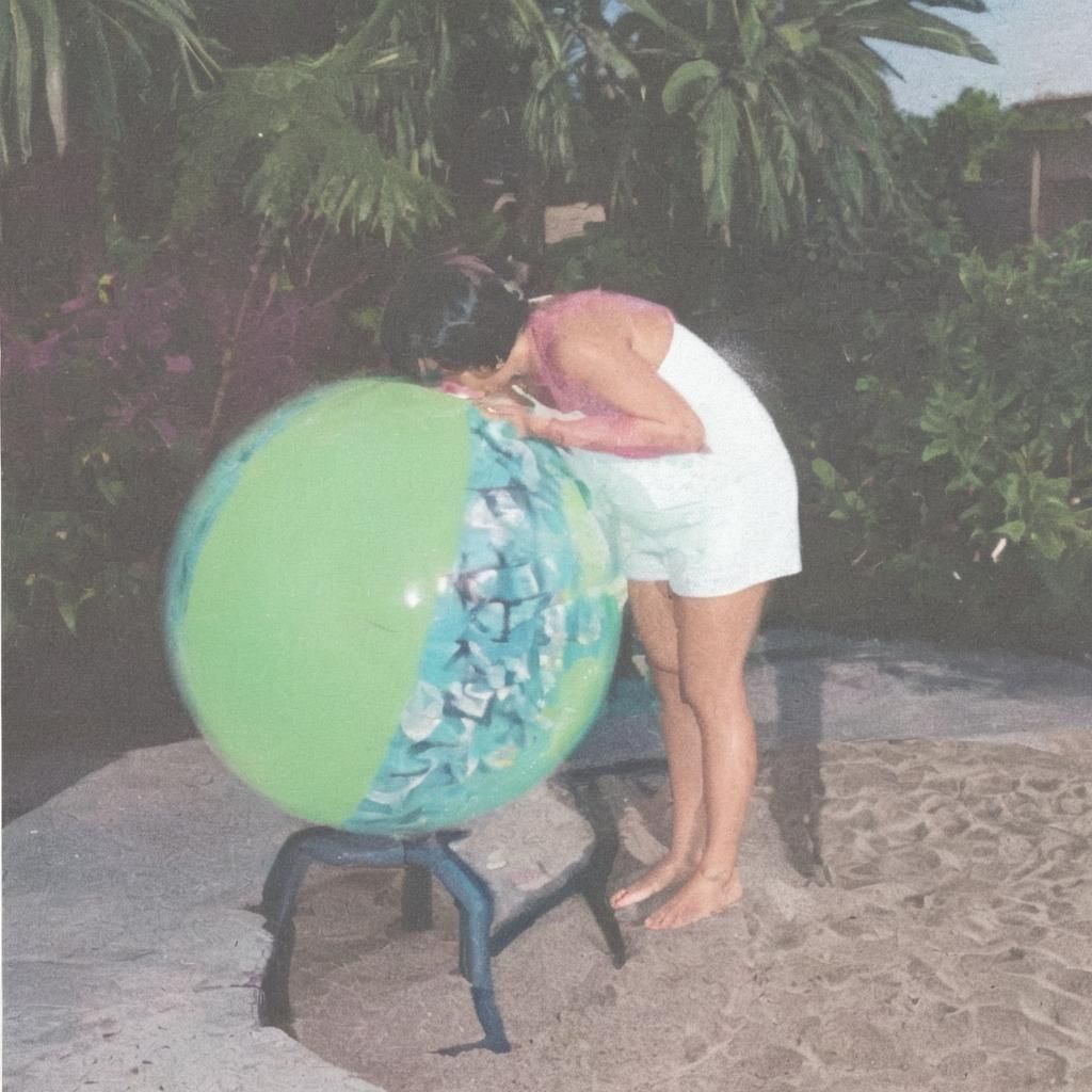 Native American Woman Inflating Beach Ball Poolside