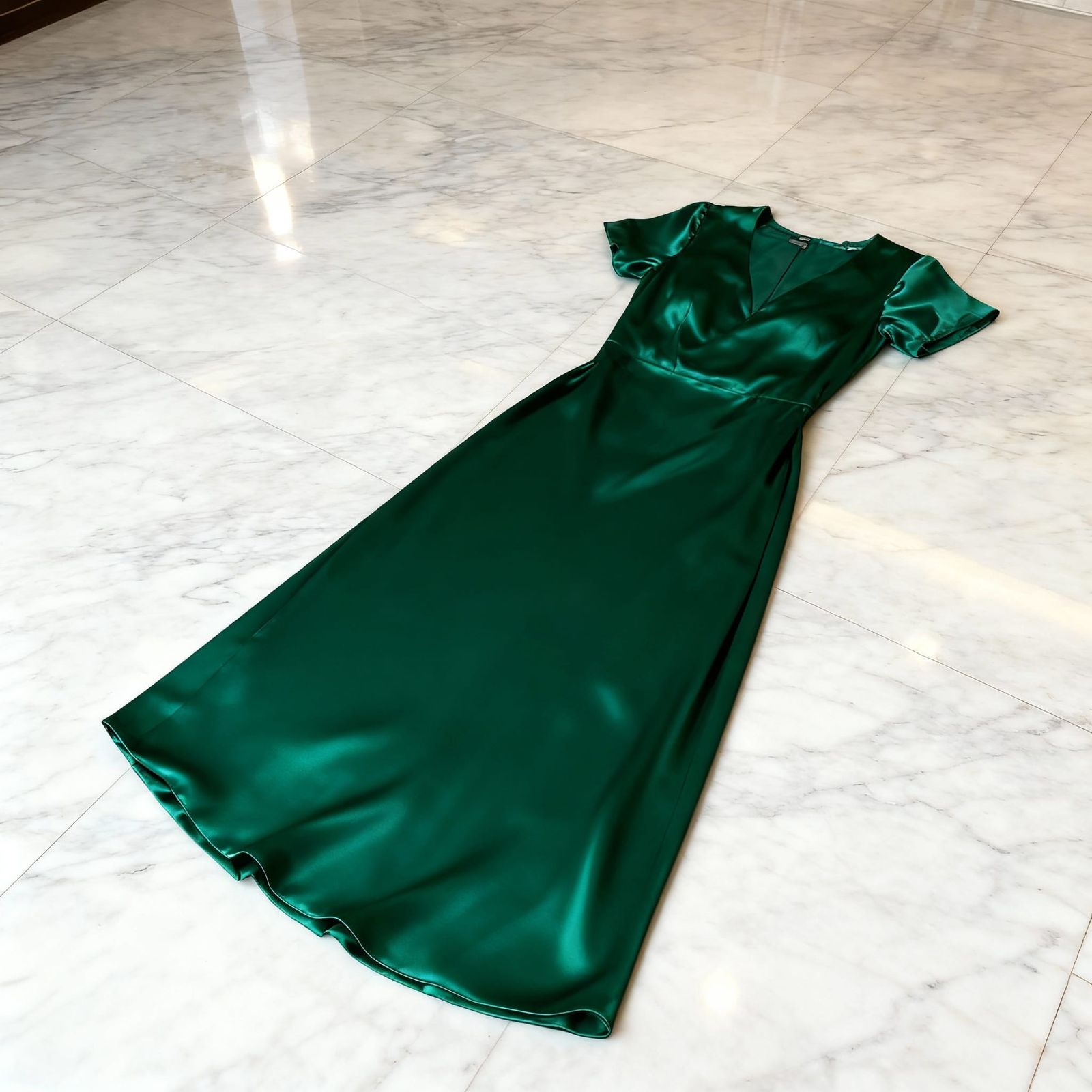 Emerald Green Silken Dress on Marble Floor
