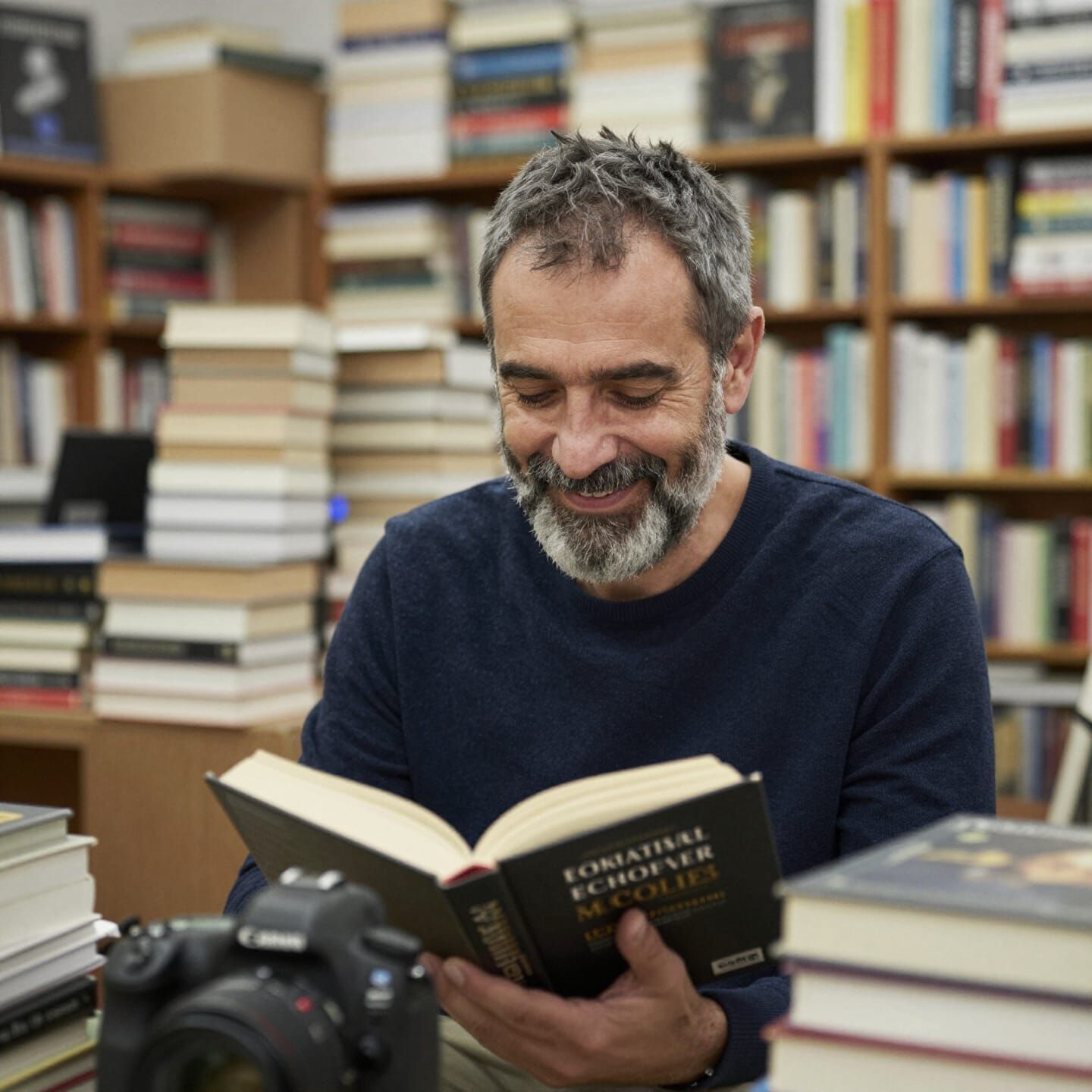 Fifty-Year-Old Italian Man Reading in Bookstore