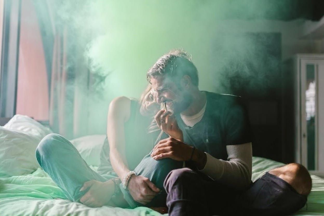 Pastel Green Bed with Wisps of Colored Smoke