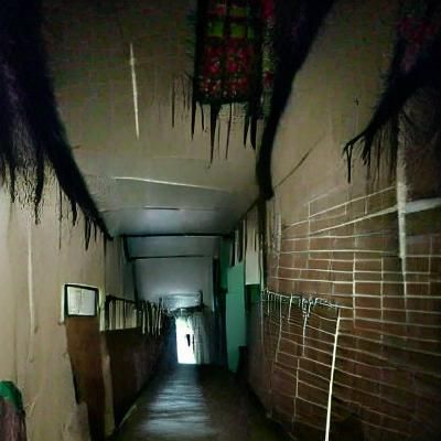 Eerie Hallway with Ominous Shadows