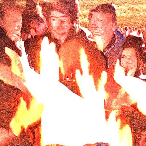 People Around Bonfire Burning Stacks of Money