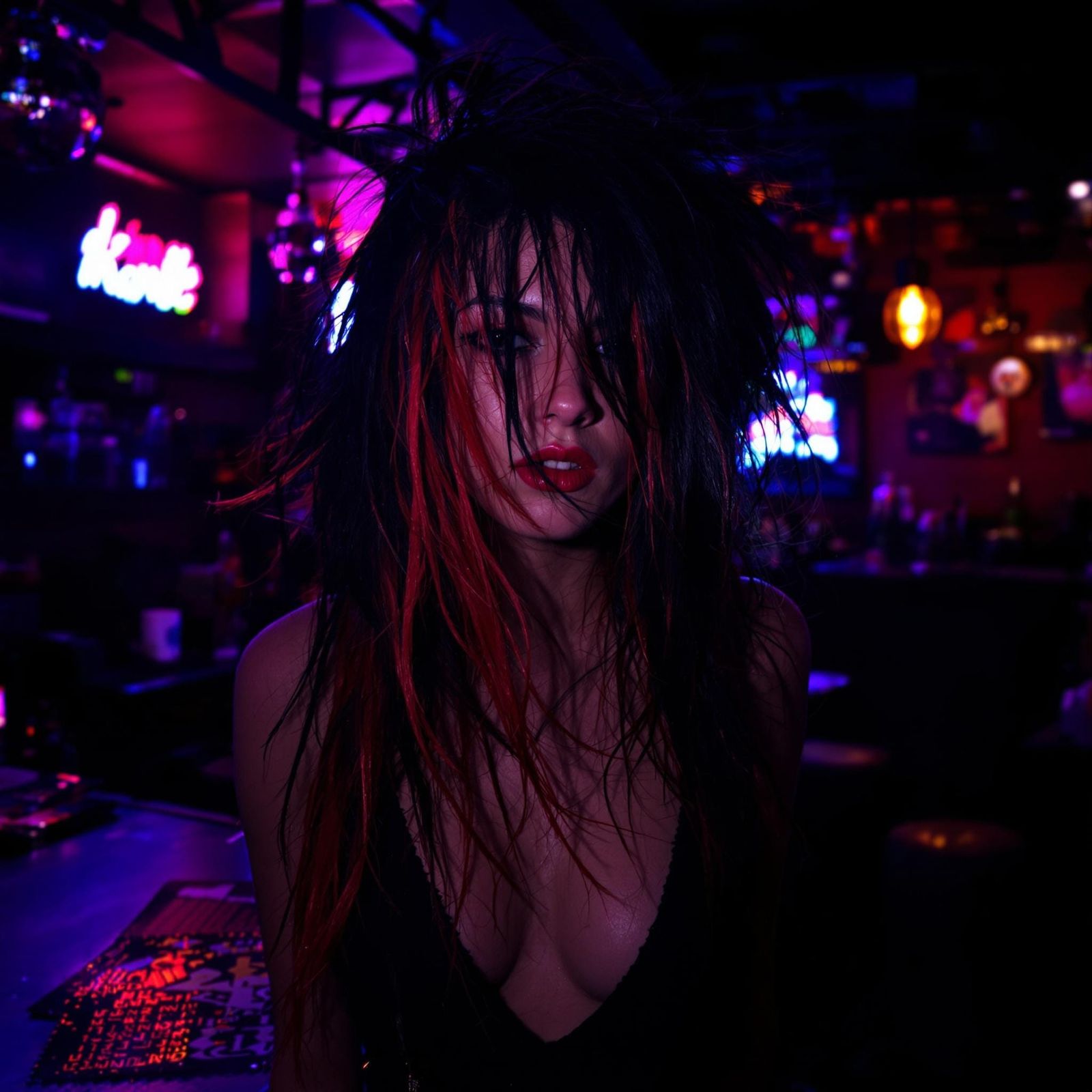 Enchanting Punk-Rock Siren in Neon Bar-Lit World