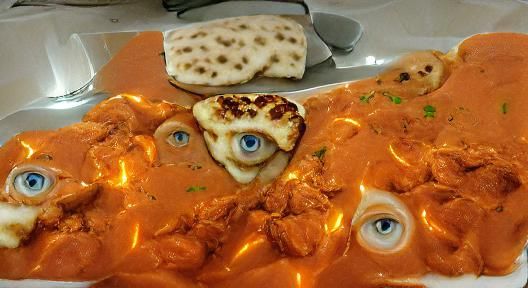 Surreal Butter Chicken with Human Eyes