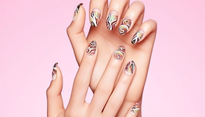 Elegant Hands with Swirling Nail Art on Pink