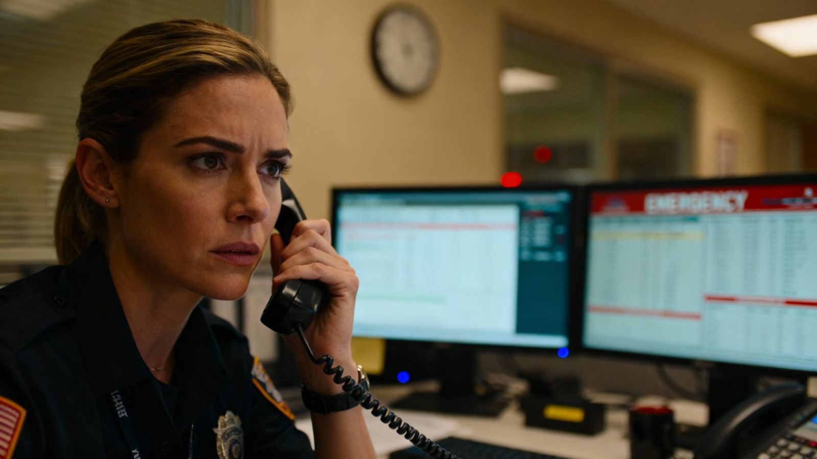 Woman Answering Phone at Emergency Center