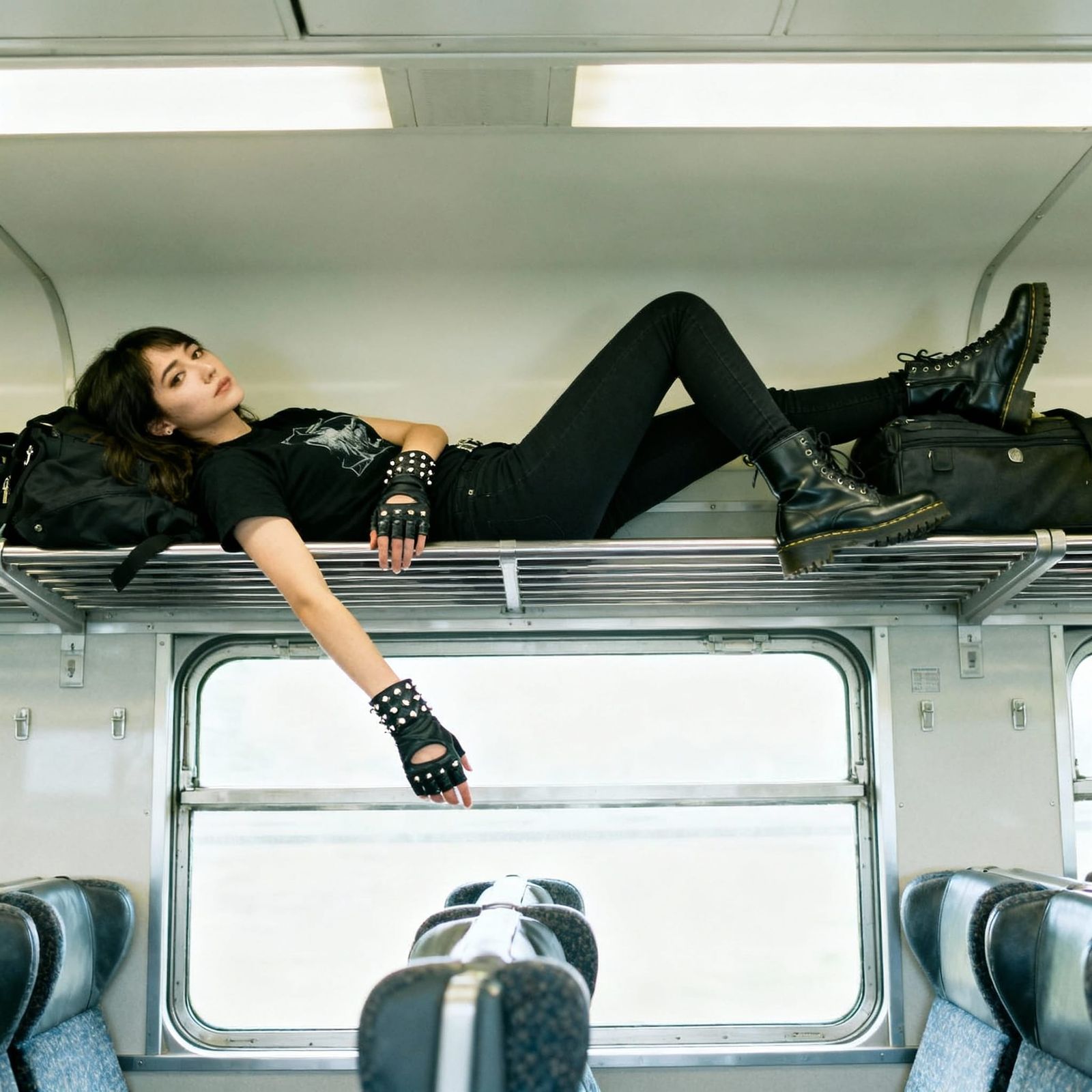 Woman Relaxing on Train Luggage Rack