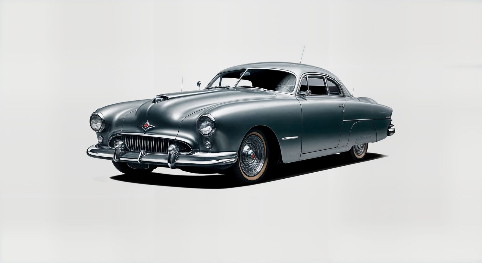 A Silver Coupe Speeds Through the Night