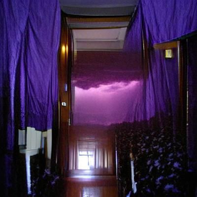 Dark Hallway with Purple Curtain and Lightning