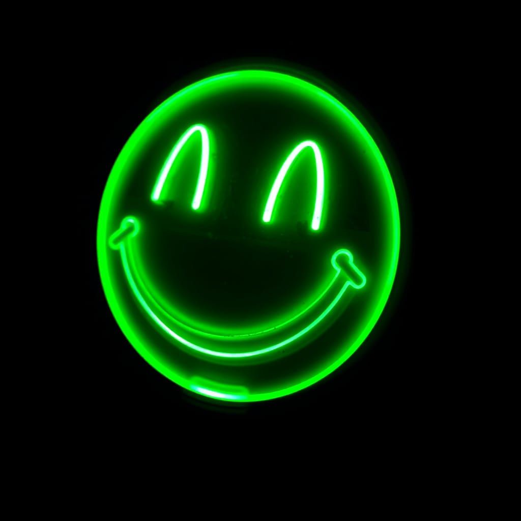 Fluorescent Smiley Face in the Dark at a Rave