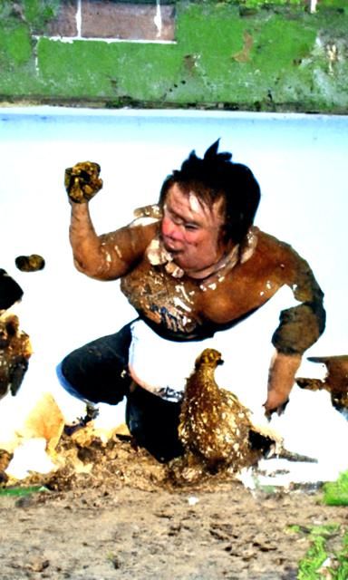 Absurdist Mud Wrestling: Miniature Wrestler vs. Chicken