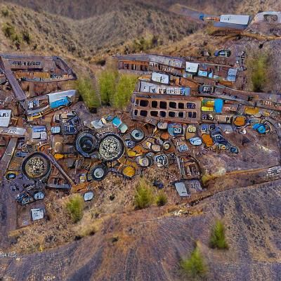 the junkyard of an abandoned mining town
