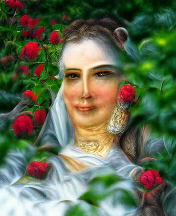 Portrait of the beautiful woman sitting in the garden of roses