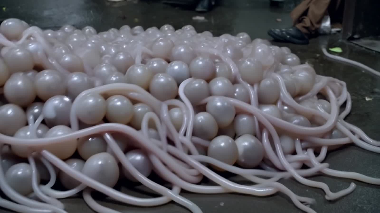 A mass of eyeballs slithering across the floor, the eye blob has numerous tentacles that writhe around as it moves.