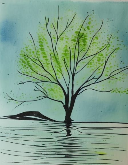 spreading green willow tree by the water