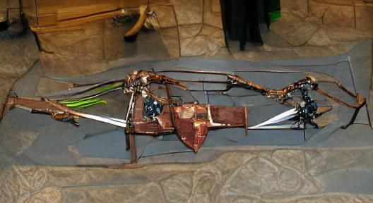 A heavy crossbow with some bolts, and a mace, and some leath...