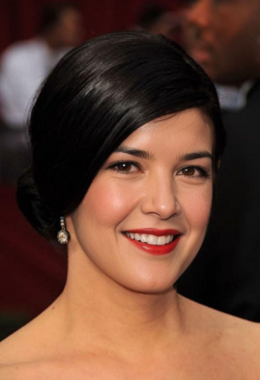 (photorealistic) Kate Upton smiling at camera, (vibrant) red dress, (stylish) black hairdo, (art brut) atmosphere, deep colors, inviting e...