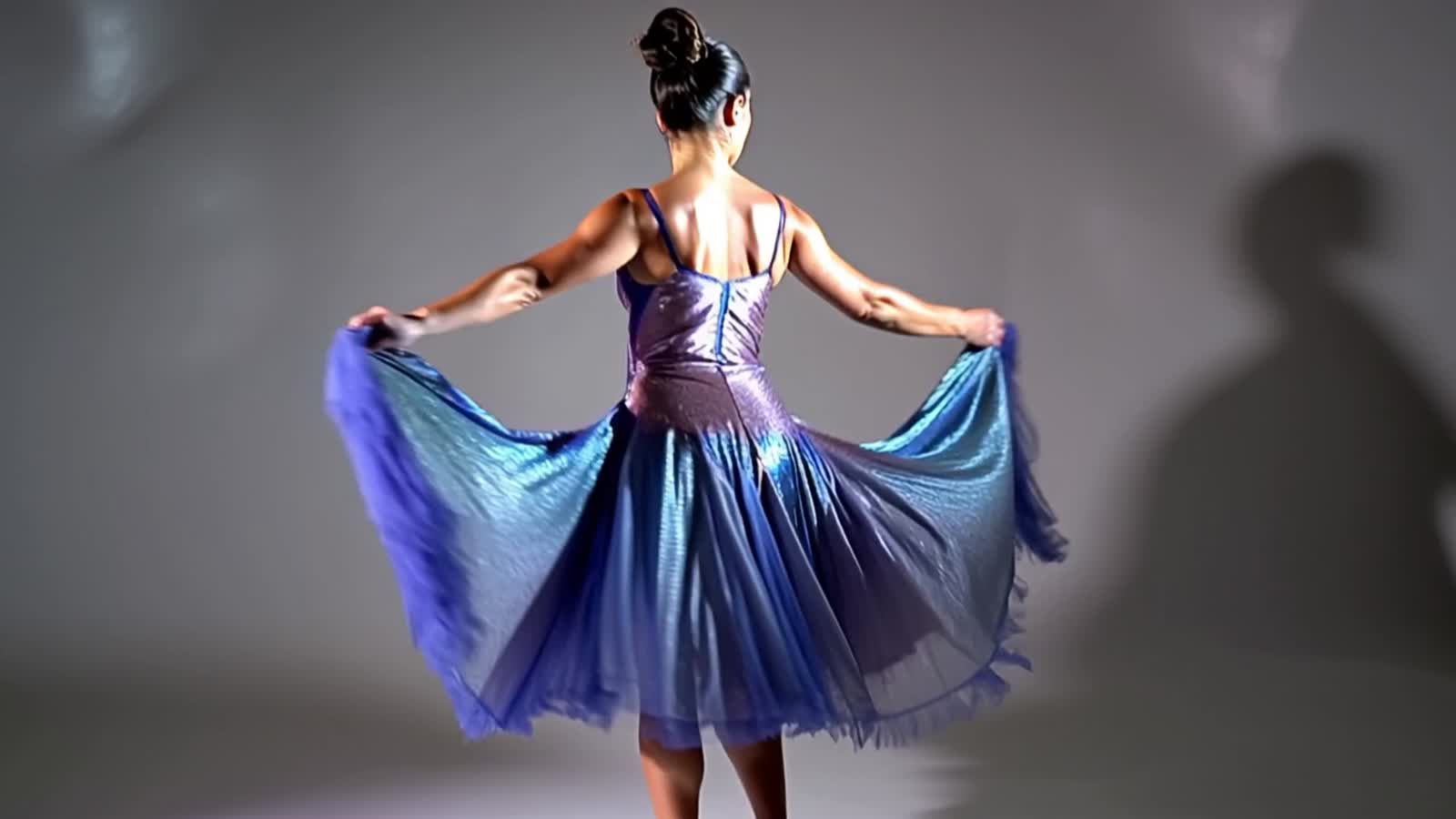 stunning woman in a flowing, iridescent dress designed for dancing, captured mid-twirl. The fabric ripples like water, c...