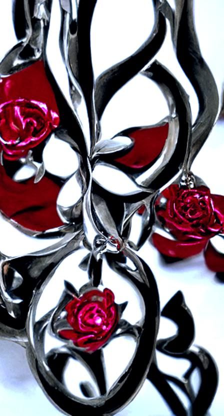 Intricate ornament...polished silver....red roses