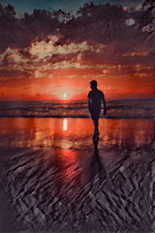 man walking by the beach against the setting sun