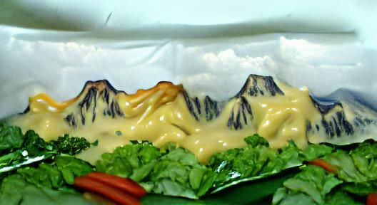 Mountain range covered ìn cheese sauce