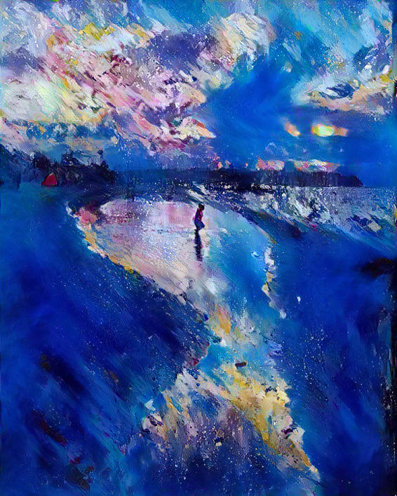 Child standing on the shore of an ocean