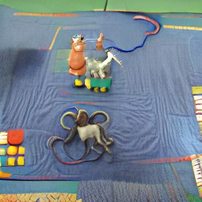 A donkey and an octopus are playing a game. The donkey is ho...
