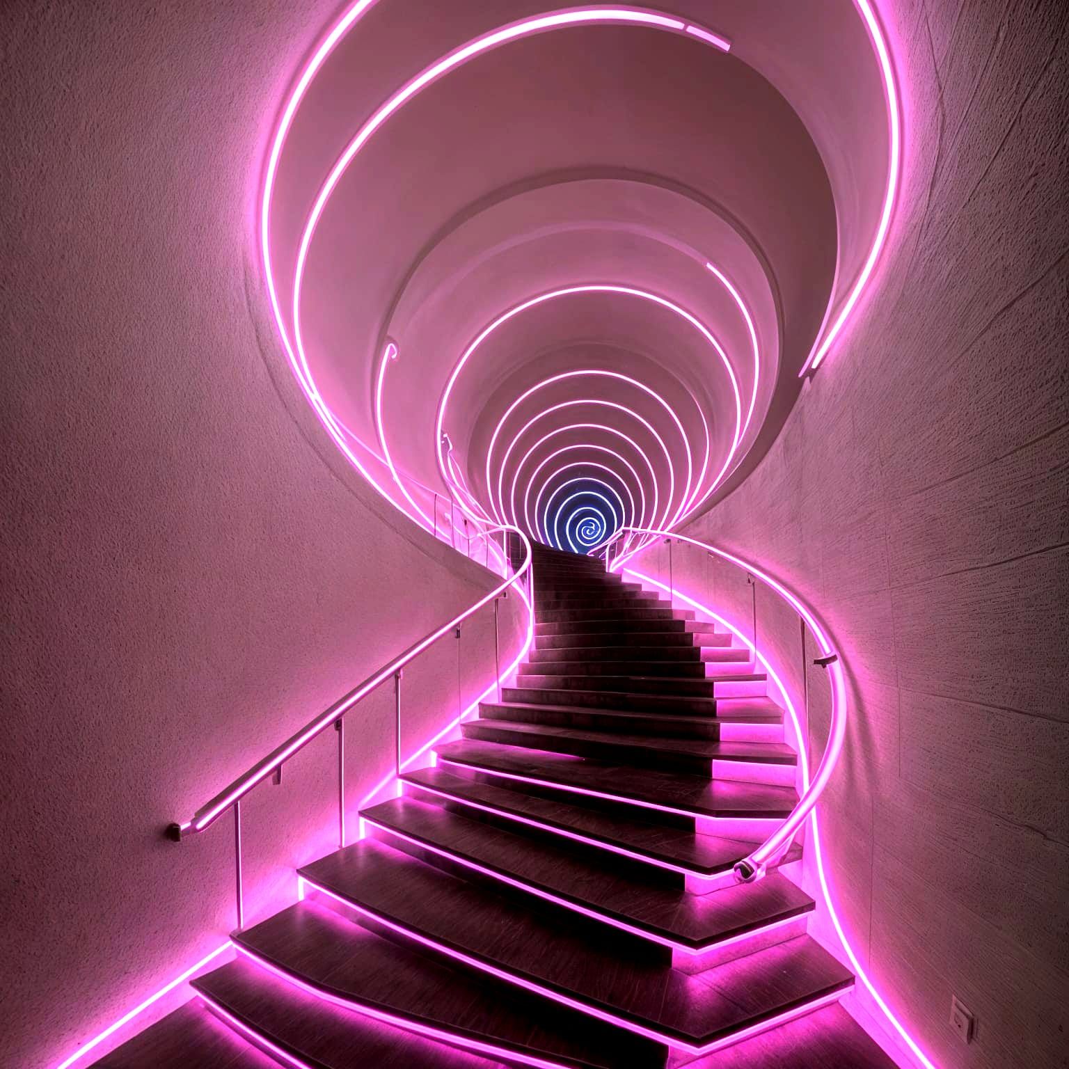 Fluorescent stairs twist upward in a glowing spiral. Each step pulses with vivid neon light. Shadows ...  by @ZoinMihailo