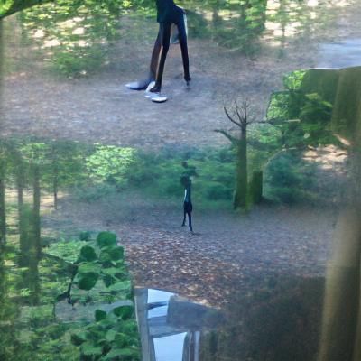 black skinny man with long legs standing outside my window o...