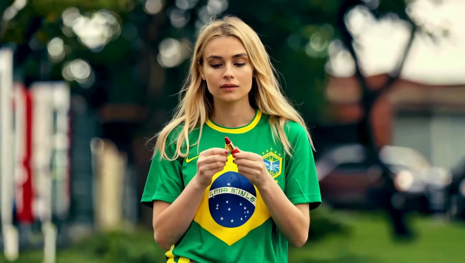 Cinematic-style scene with soft, realistic lighting.
A blonde woman with fair skin and dark brown eyes, with a gentle ye...