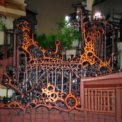 Elaborate and complex wrought iron gate.