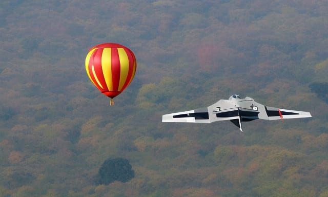 strange balloon and fighter jet