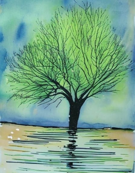 spreading green willow tree by the water