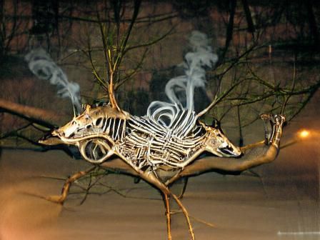 Deer skeleton made of tree branches and smoke