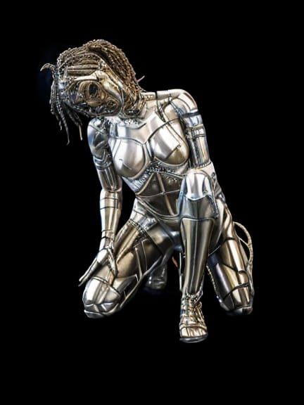 Bronze smiling female cyborg statue