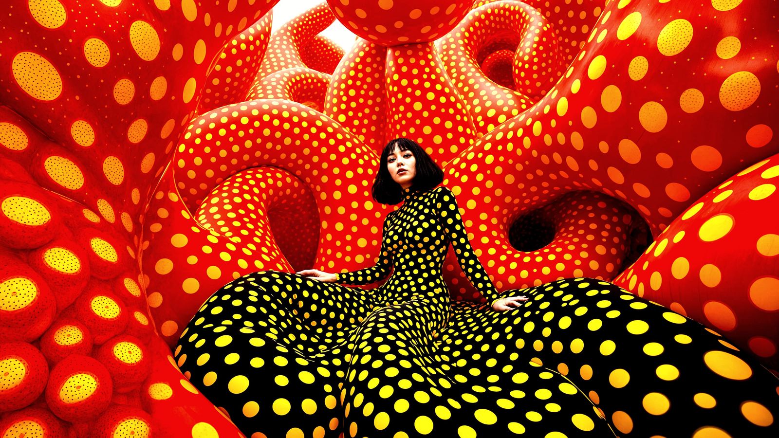 retrospective polka dots.
yayoi kusama wearing  black  & yellow polka dress. 
yellow conical twisted ...  by @Azee