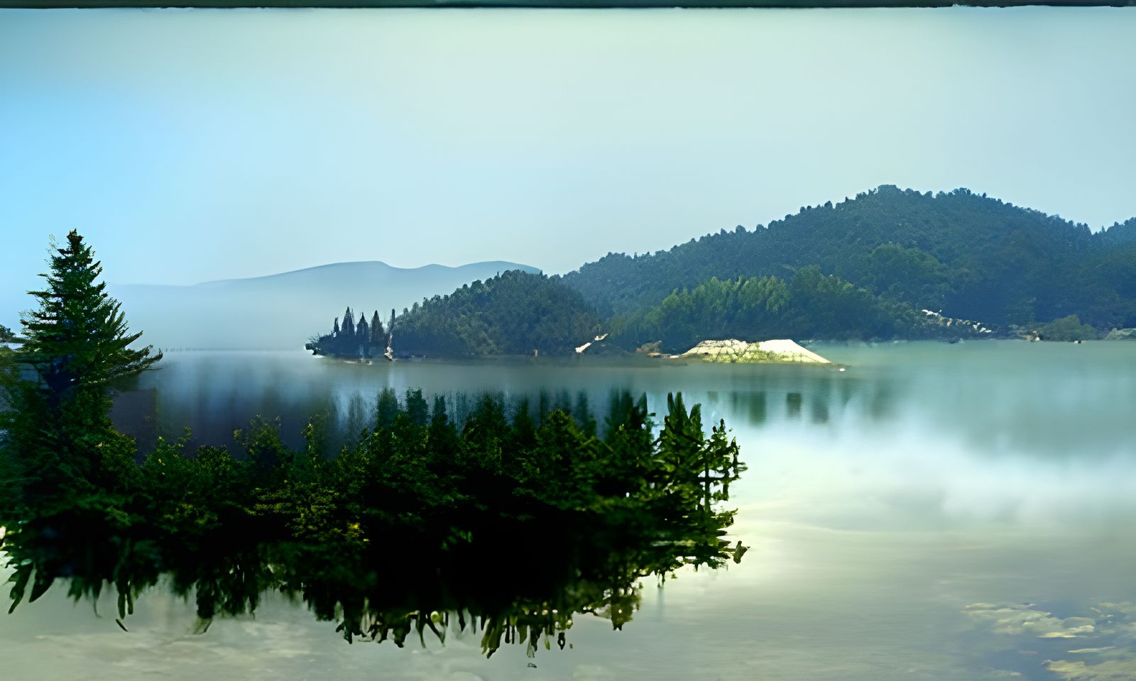 a small lake with clear waters, with a dark pine forest arou...
