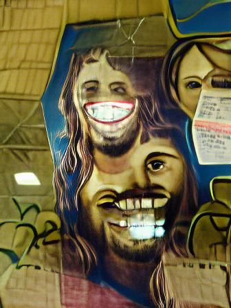 A portrait of Freaky faced Jesus crazy smile