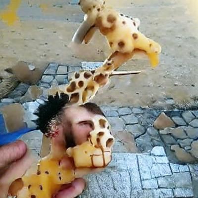 decapitated man eating giraffes