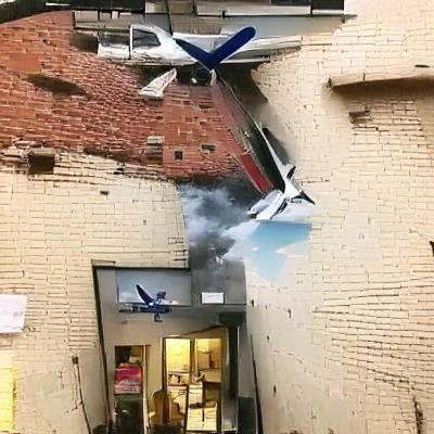 Plane crashing into a building